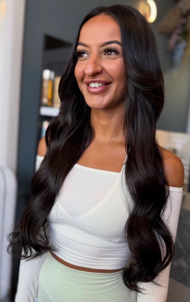 After: long, full, dark brown waves.
