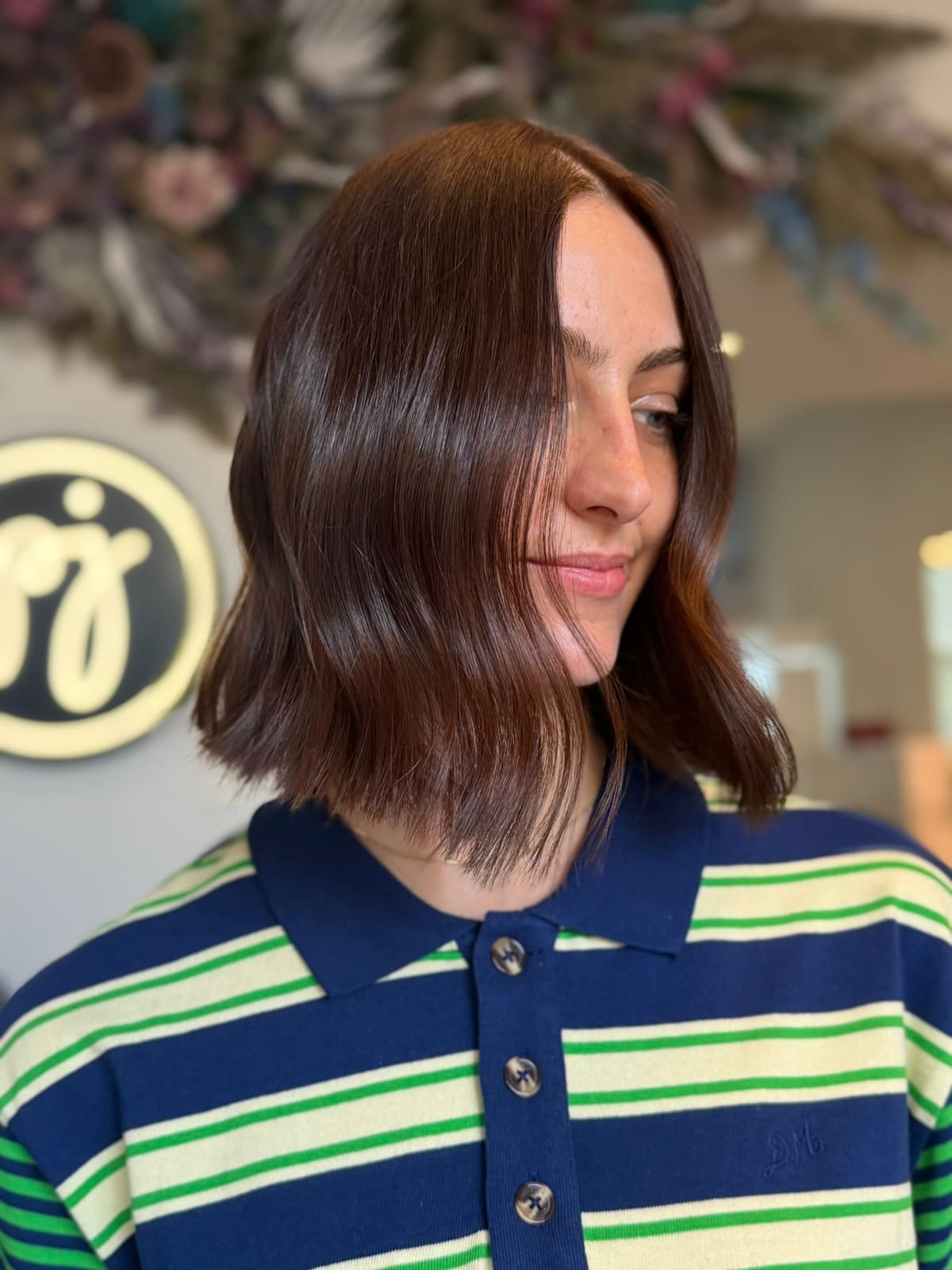 After: a glossy collarbone-length lob with a soft bend at the ends.