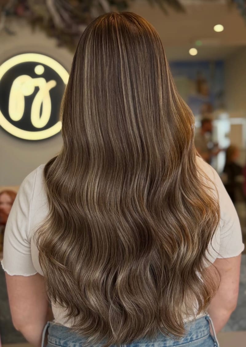 Ash brown through long hair, seen from behind.