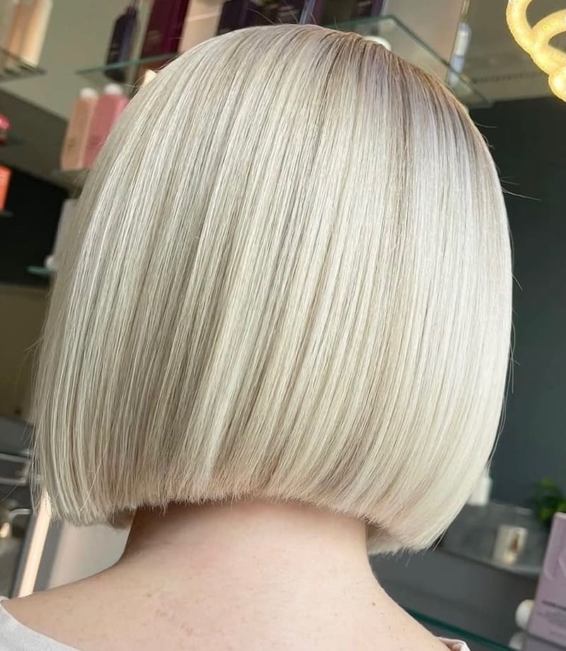 A sleek blonde bob, seen from behind.