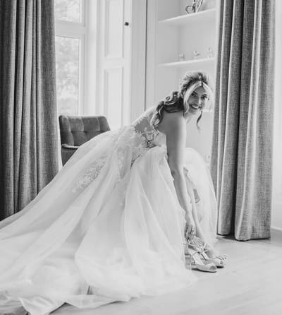 A bride’s hair finished for the day, in black and white.
