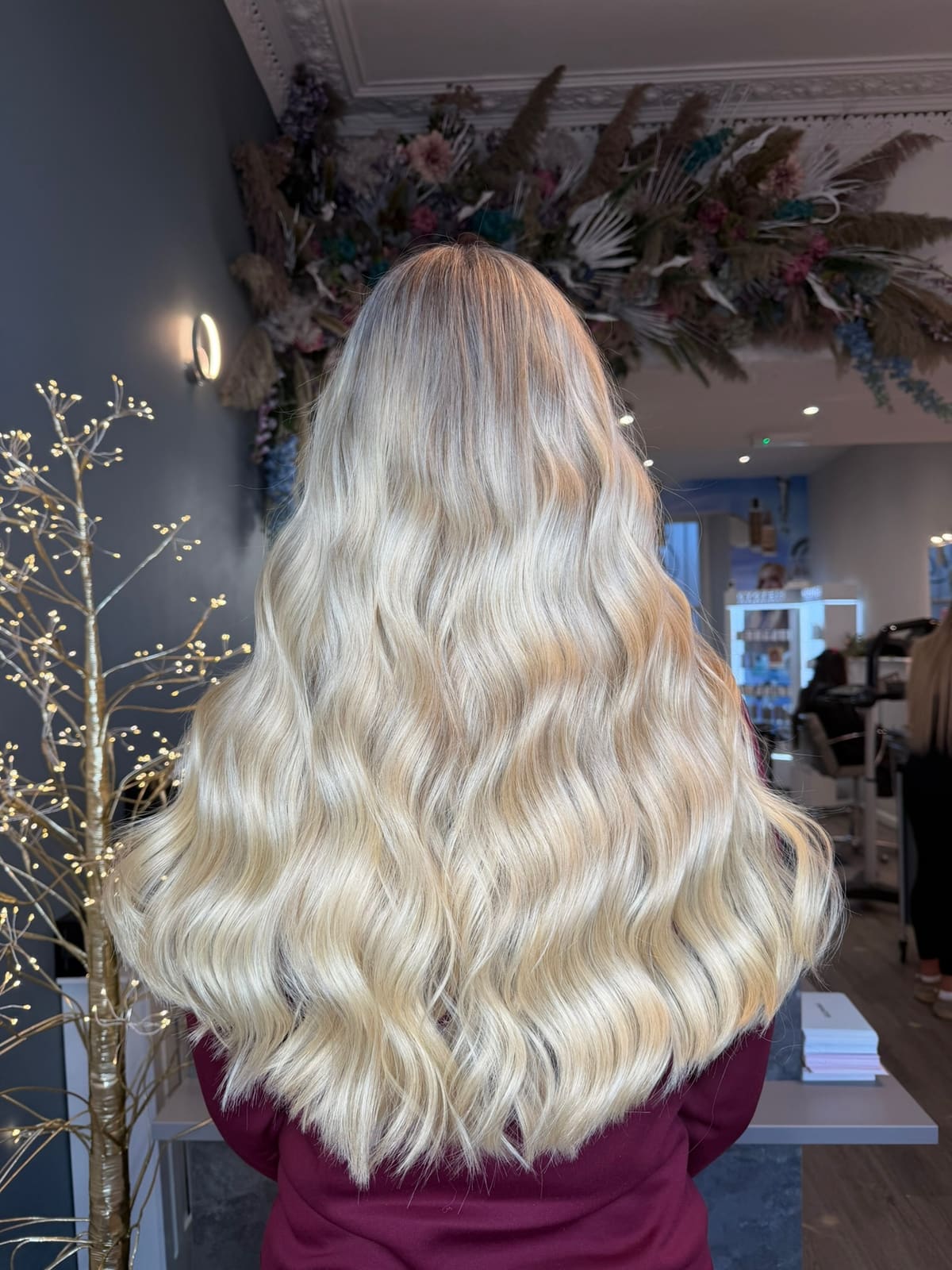 Platinum blonde through long hair, seen from behind.