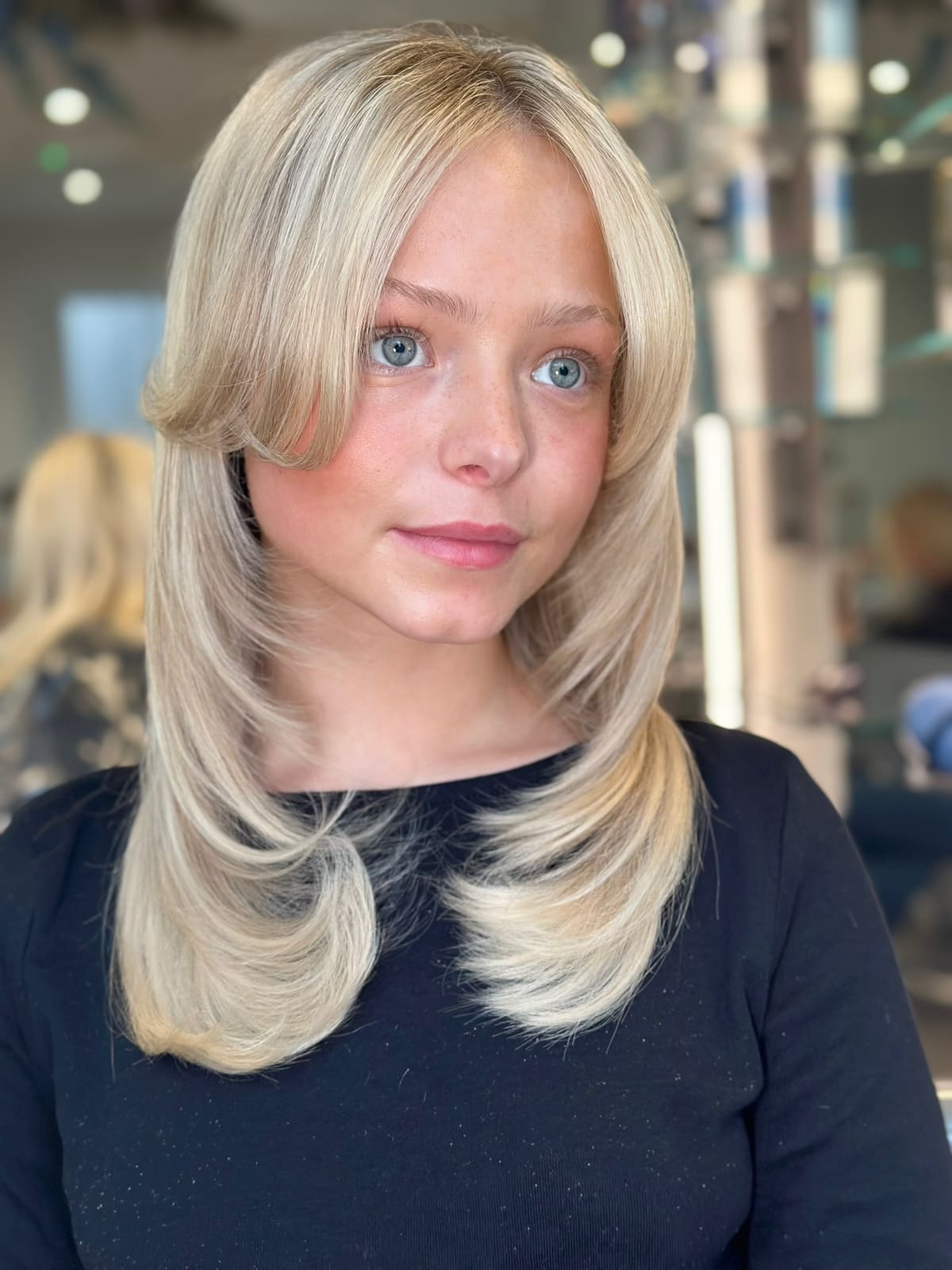 Soft blonde layers around the face.